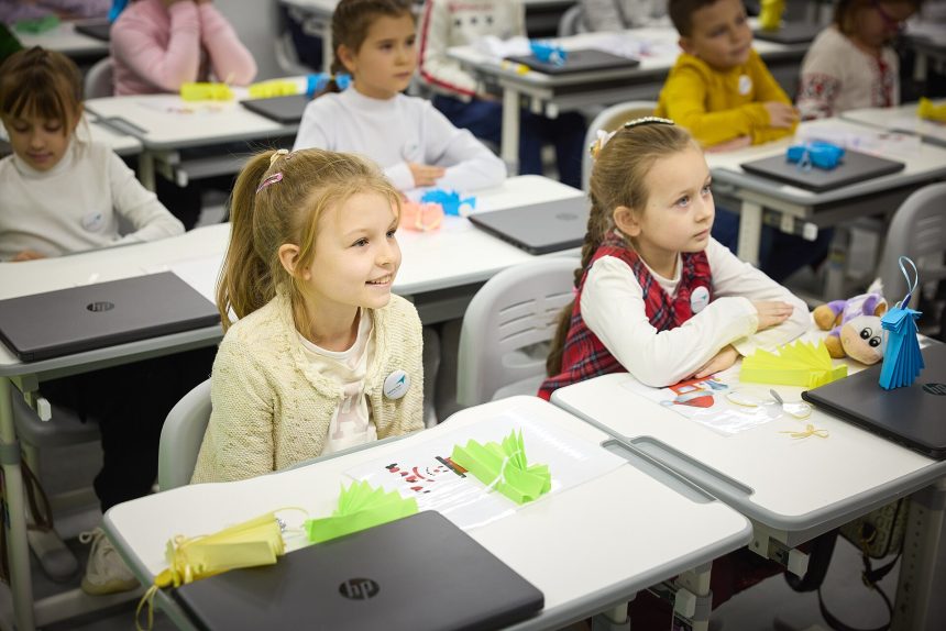 Students learning in a phone-free classroom, focused on their lesson