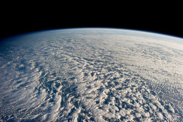 A satellite view of storm systems over Earth, the kind of data now feeding AI weather forecasting models.
