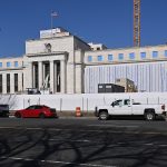 Central bank buildings in Washington and Frankfurt as the Fed, ECB and Bank of Japan pursue divergent policies.