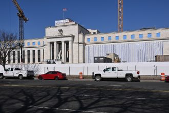 Central bank buildings in Washington and Frankfurt as the Fed, ECB and Bank of Japan pursue divergent policies.