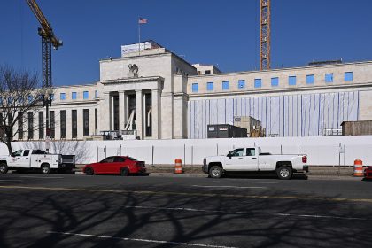 Central bank buildings in Washington and Frankfurt as the Fed, ECB and Bank of Japan pursue divergent policies.