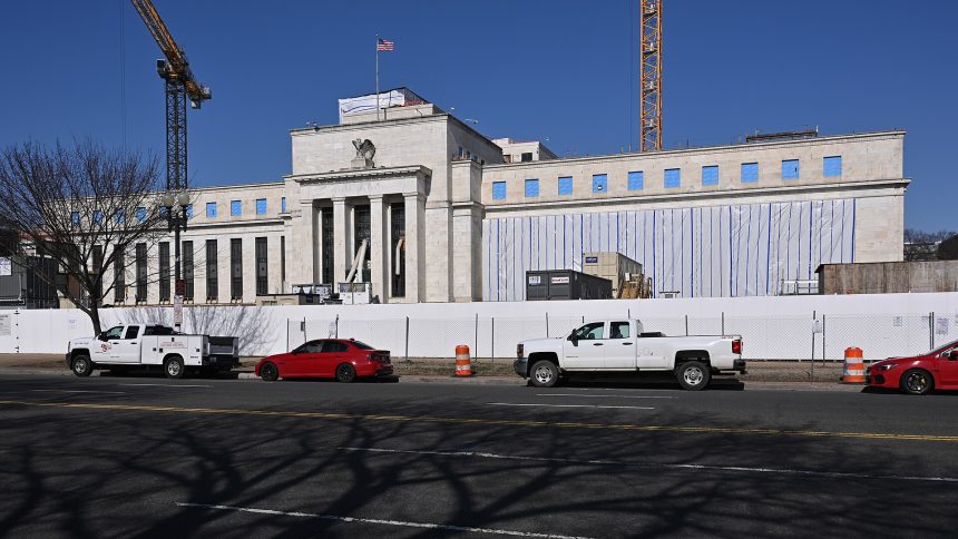 Central bank buildings in Washington and Frankfurt as the Fed, ECB and Bank of Japan pursue divergent policies.